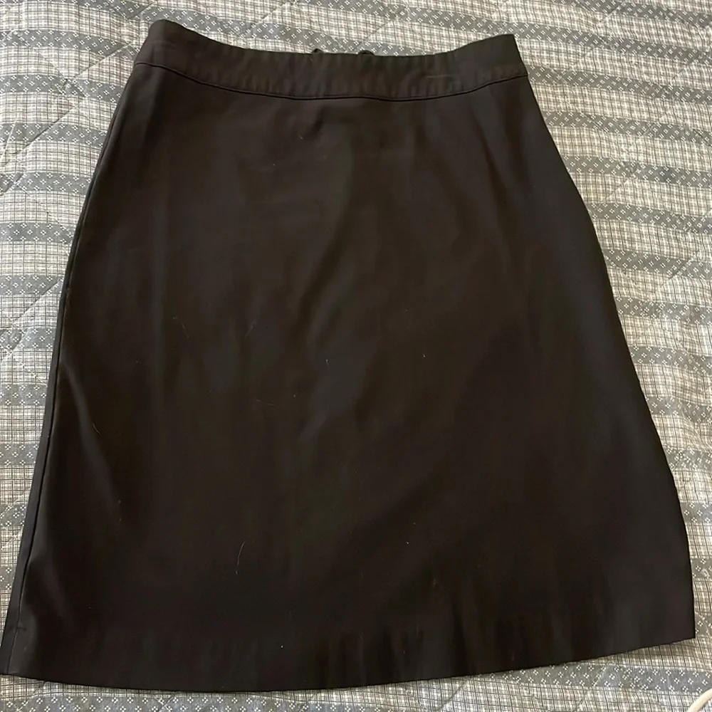 Women’s size 6, black pencil skirt stretchy. Lattice lace up. Hidden side zipper